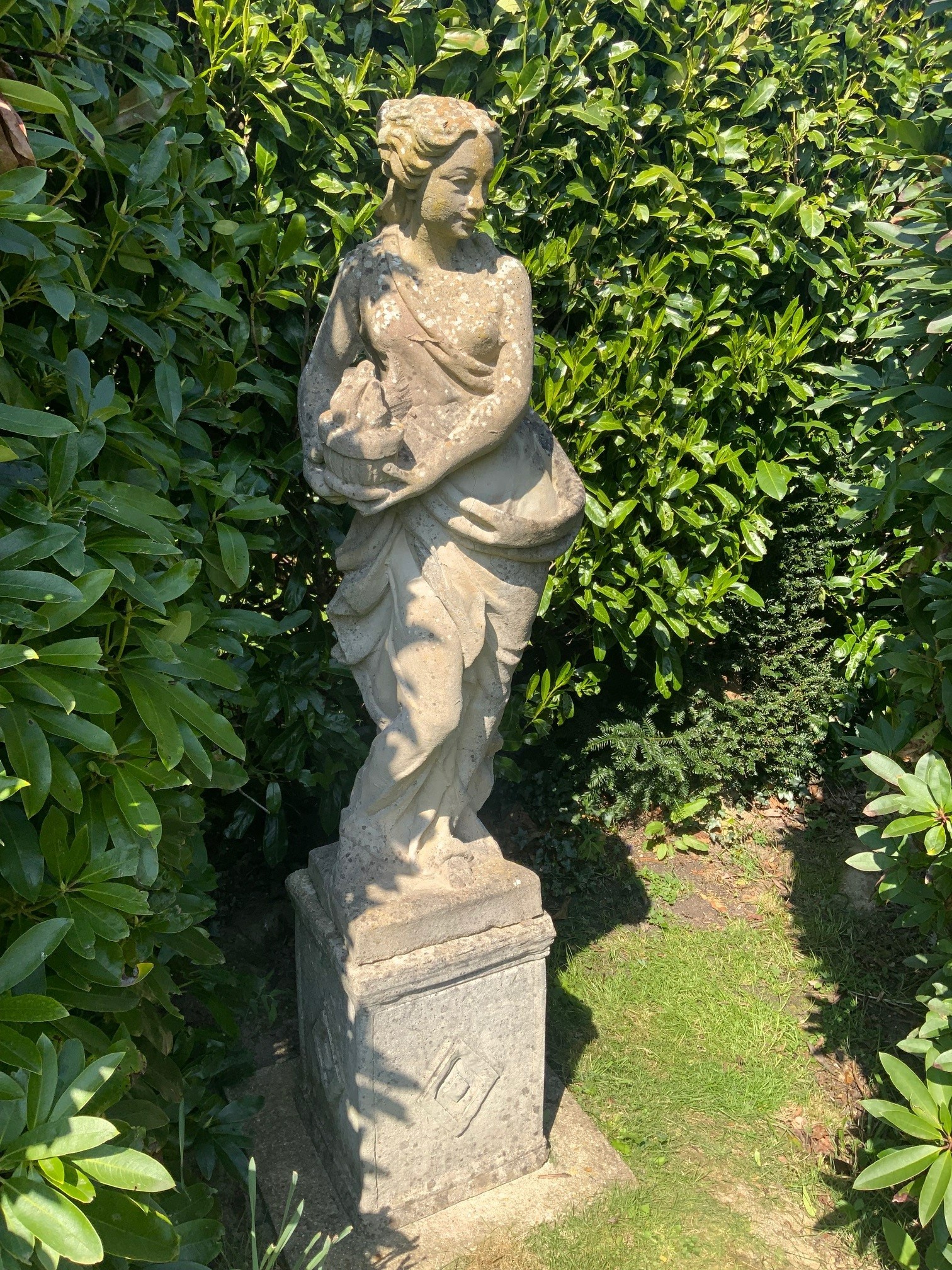 A set of four reconstituted stone garden figures, representing the Four Seasons, tallest 170cm